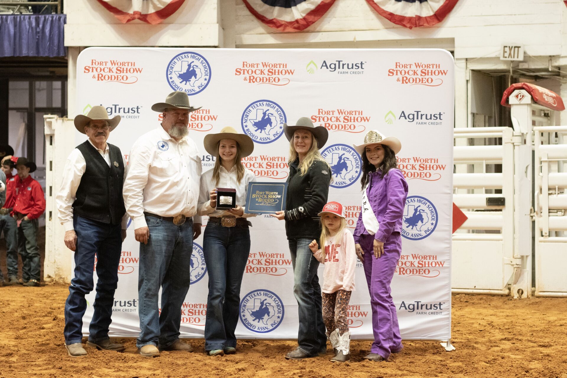 Lindsey Ellsworth presenting awards at North Texas High School Rodeo Association Finals during Fort Worth Stock Show & Rodeo in Feb 2024.