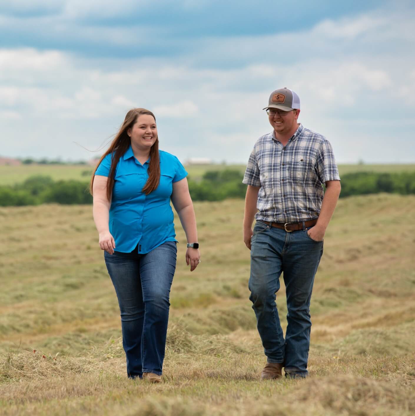Couple walking in field